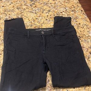 12R American Eagle black super stretch x skinnies